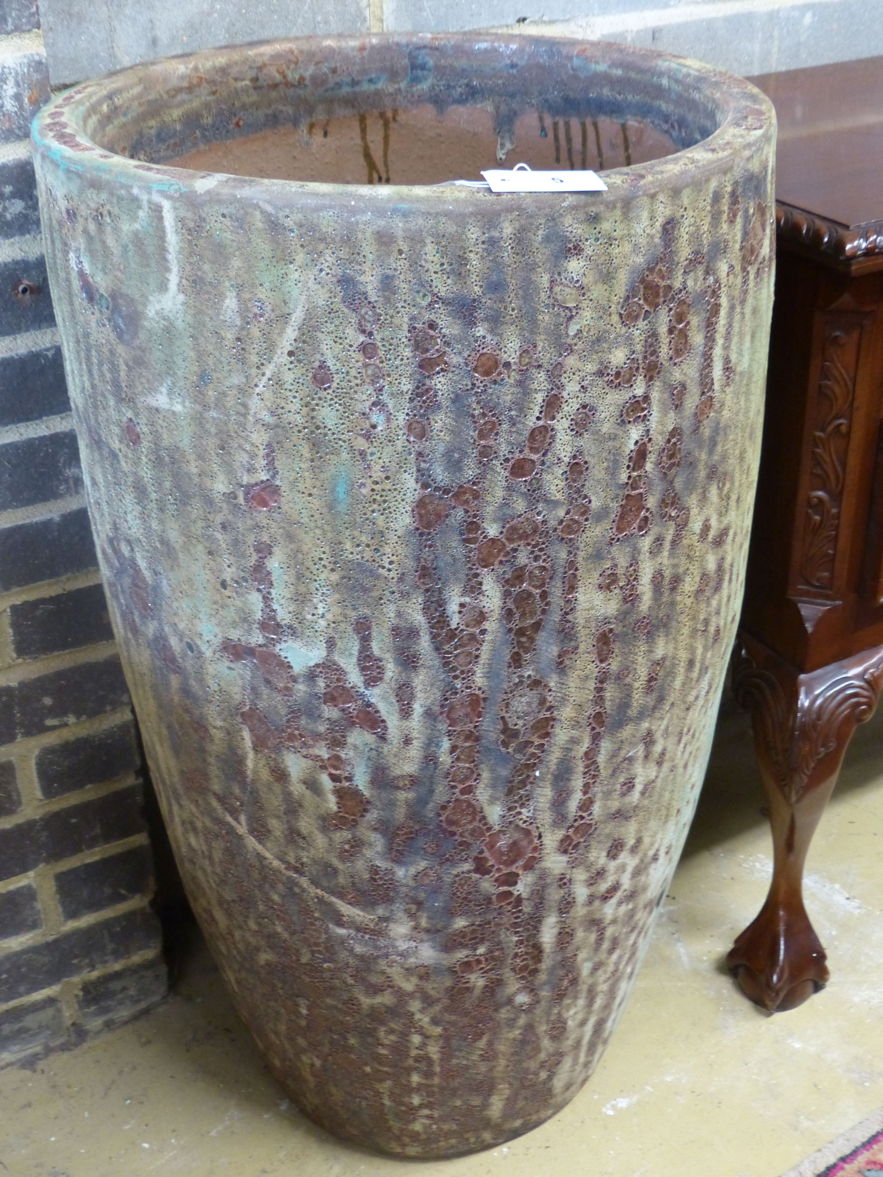 A tall glazed Earthenware garden planter, diameter 54cm height 94cm